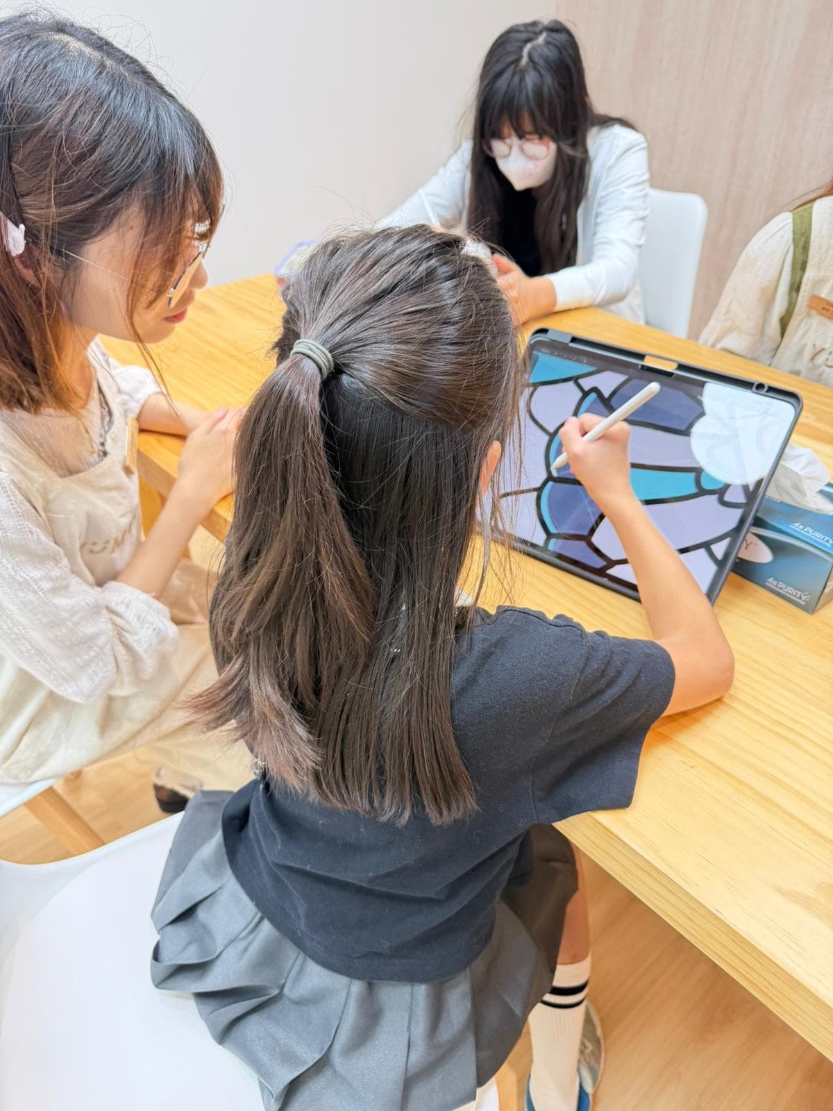 Student working on digital art at Yumewa Academy drawing tablet